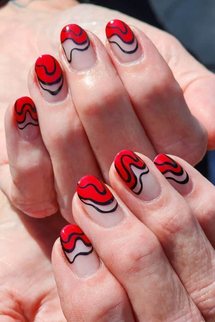 red nail black swirl design